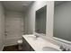 Bright bathroom featuring a double sink vanity, a large mirror, and a shower and tub with white tile at 210 Blue Haw Dr, Moncks Corner, SC 29461