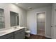 Bathroom featuring double sink vanity, large mirror, and walk in closet at 210 Blue Haw Dr, Moncks Corner, SC 29461