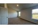 Cozy bedroom with natural light, neutral paint, and soft carpet for a peaceful retreat at 210 Blue Haw Dr, Moncks Corner, SC 29461
