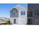 Charming two-story home with gray and white siding and an attached garage, perfect for a new Gathering at 210 Blue Haw Dr, Moncks Corner, SC 29461