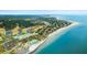 Beautiful aerial view featuring residences by the ocean, a golf course, and a community pool at 2119 Landfall Way, Seabrook Island, SC 29455