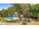 An aerial view of a pool amenity with seating, umbrellas, grills, and kayak storage at 2119 Landfall Way, Seabrook Island, SC 29455