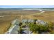 Stunning aerial view of a marshfront condo community showcasing lush landscaping and beautiful water views at 2119 Landfall Way, Seabrook Island, SC 29455