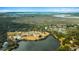 Aerial view displaying community ammenities including pool, clubhouse, lake and marshland at 2119 Landfall Way, Seabrook Island, SC 29455