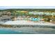 Aerial view of the resort featuring a beach with a pool, condos, and verdant landscaping at 2119 Landfall Way, Seabrook Island, SC 29455