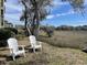 Tranquil backyard area with comfortable seating, perfect for enjoying the natural surroundings and marsh views at 2119 Landfall Way, Seabrook Island, SC 29455