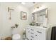 Bright bathroom features a vanity, modern mirror, toilet, framed art, and stylish fixtures for a relaxing atmosphere at 2119 Landfall Way, Seabrook Island, SC 29455