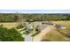 Aerial image featuring a house with horse stalls, outdoor arena and grassy areas at 2119 Landfall Way, Seabrook Island, SC 29455