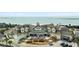 Stunning exterior view of a large clubhouse, close to the water and golf carts parked in front at 2119 Landfall Way, Seabrook Island, SC 29455
