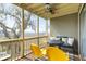 Inviting covered porch features comfortable seating and scenic views of the surrounding marshland at 2119 Landfall Way, Seabrook Island, SC 29455