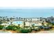 Inviting aerial perspective of a community pool area with palm trees, sun loungers, and sandy beach views at 2119 Landfall Way, Seabrook Island, SC 29455