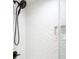 Clean shower with white herringbone tile, a shower head, and a glass enclosure in a renovated bathroom at 2119 Landfall Way, Seabrook Island, SC 29455