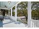 Inviting balcony view with classic white columns, offering outdoor space and a charming neighborhood view at 214 Calhoun St # 5, Charleston, SC 29401