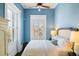 Bedroom featuring plantation shutters, a ceiling fan, and natural light at 214 Calhoun St # 5, Charleston, SC 29401
