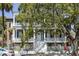 Stately home with a gated front entrance, covered porch, and mature landscaping at 214 Calhoun St # 5, Charleston, SC 29401