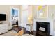 Cozy living room with a decorative fireplace, comfortable seating, and hardwood floors for a classic look at 214 Calhoun St # 5, Charleston, SC 29401