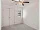 A bright bedroom with carpet, a ceiling fan, a window, and double-door closet at 2362 Parsonage Rd # 17G, Charleston, SC 29414