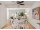 Dining area with white table and chairs open to the living room at 2362 Parsonage Rd # 17G, Charleston, SC 29414