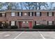 Brick building with black shutters, red doors, and parking at 2362 Parsonage Rd # 17G, Charleston, SC 29414