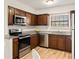 Updated kitchen with stainless steel appliances, granite countertops, and dark wood cabinetry at 2362 Parsonage Rd # 17G, Charleston, SC 29414