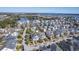 Expansive aerial view of a residential neighborhood with diverse home styles and a picturesque lake at 2506 Gatewood St, Charleston, SC 29492