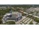 Aerial view showcasing the community, nearby lake, lush landscaping, and convenient access to commercial area at 2506 Gatewood St, Charleston, SC 29492