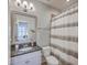 Bathroom featuring a single sink vanity with a granite countertop, toilet, and a shower with patterned curtain at 2506 Gatewood St, Charleston, SC 29492