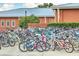 A large number of bikes are locked to bike racks in front of a building at 2506 Gatewood St, Charleston, SC 29492