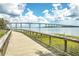 Picturesque boardwalk with views of a bridge, waterway, and marsh grasses under a blue sky at 2506 Gatewood St, Charleston, SC 29492