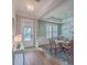 Elegant dining room boasts wood floors, wainscoting, a stylish chandelier, and abundant natural light at 2506 Gatewood St, Charleston, SC 29492