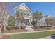 Charming two-story home features a double porch, palm trees, and a well-manicured lawn, with a classic American flag at 2506 Gatewood St, Charleston, SC 29492