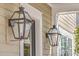 Close up of front porch with attractive hanging lights, decorative molding and well maintained exterior at 2506 Gatewood St, Charleston, SC 29492