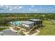 Beautiful community pool with sun loungers, shade, and palm trees near athletic fields at 2506 Gatewood St, Charleston, SC 29492