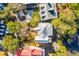 Birds eye view of a property surrounded by mature trees, featuring a well-maintained lawn at 26 Saturday Rd, Mount Pleasant, SC 29464