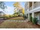 Charming backyard with stepping stones and lush greenery next to the lovely home at 26 Saturday Rd, Mount Pleasant, SC 29464