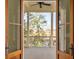 Covered balcony offers views of a marsh through tall trees at 26 Saturday Rd, Mount Pleasant, SC 29464