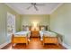 Well-lit bedroom featuring two beds, hardwood floors, and neutral paint at 26 Saturday Rd, Mount Pleasant, SC 29464