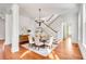 Dining area showcasing hardwood floors, round table, stairs, and elegant details at 26 Saturday Rd, Mount Pleasant, SC 29464