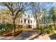 Beautiful exterior view of a home with lush trees, showcasing the covered parking and brick stairs at 26 Saturday Rd, Mount Pleasant, SC 29464