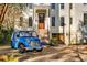 Exterior view of a well-kept home with a blue vehicle parked out front, highlighting the curb appeal at 26 Saturday Rd, Mount Pleasant, SC 29464