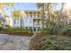 Beautiful home with double porches, a walkway, mature landscaping and trees at 26 Saturday Rd, Mount Pleasant, SC 29464