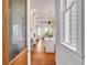 Hallway view leading to kitchen shows hardwood floors and an open concept design at 26 Saturday Rd, Mount Pleasant, SC 29464