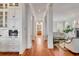 Hallway features hardwood floors, white trim and leads to an open living space at 26 Saturday Rd, Mount Pleasant, SC 29464
