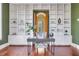 Inviting home office featuring custom built-ins, a stylish desk, and beautiful hardwood floors at 26 Saturday Rd, Mount Pleasant, SC 29464