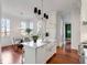 Bright kitchen features a farmhouse sink, modern lighting, and an adjacent dining area at 26 Saturday Rd, Mount Pleasant, SC 29464