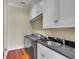 Laundry room with front-loading washer and dryer, sink, and ample counter space at 26 Saturday Rd, Mount Pleasant, SC 29464
