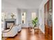 Bright living area with fireplace, hardwood floors and stylish design accents at 26 Saturday Rd, Mount Pleasant, SC 29464