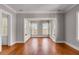 Open living room with hardwood floors, views, and transom windows at 26 Saturday Rd, Mount Pleasant, SC 29464