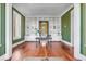 Large office space with custom built-in bookshelves and ample natural light at 26 Saturday Rd, Mount Pleasant, SC 29464