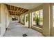 Spacious covered outdoor patio featuring concrete floor and views of the lush backyard landscape at 26 Saturday Rd, Mount Pleasant, SC 29464